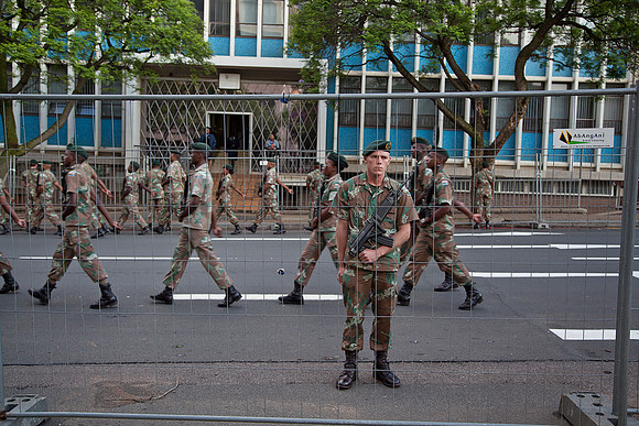 South African military line the streets of Pretoria ahead of Nelson Mandela's cortege.